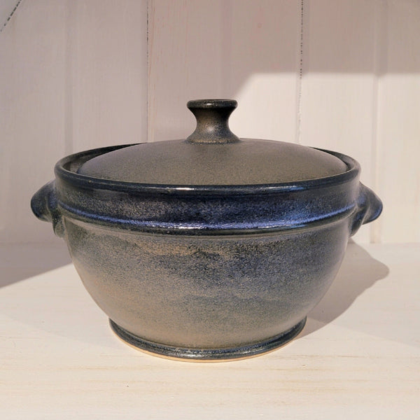 Granite grey ceramic pot with lid on a white surface