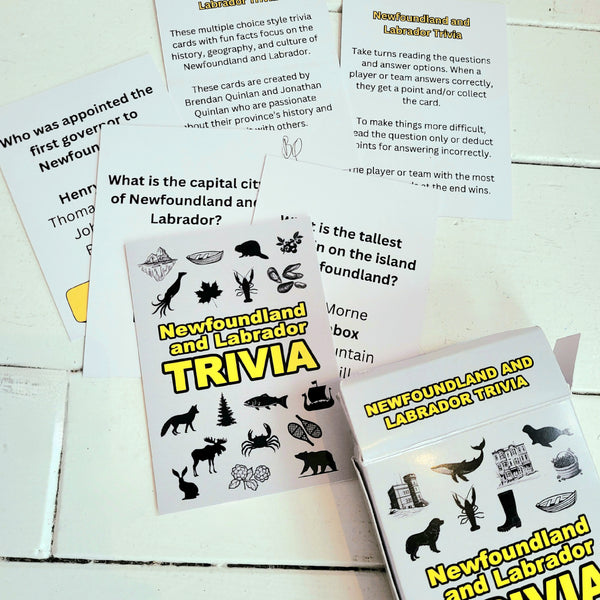 Newfoundland and Labrador trivia cards on a wooden surface