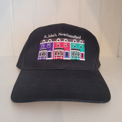 Baseball cap with purple, pink, and teal houses on the front
