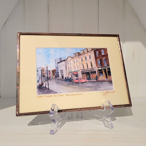 Copper framed art reproduction by Cynthia Noel titled "Water Street, St. John's, Newfoundland".