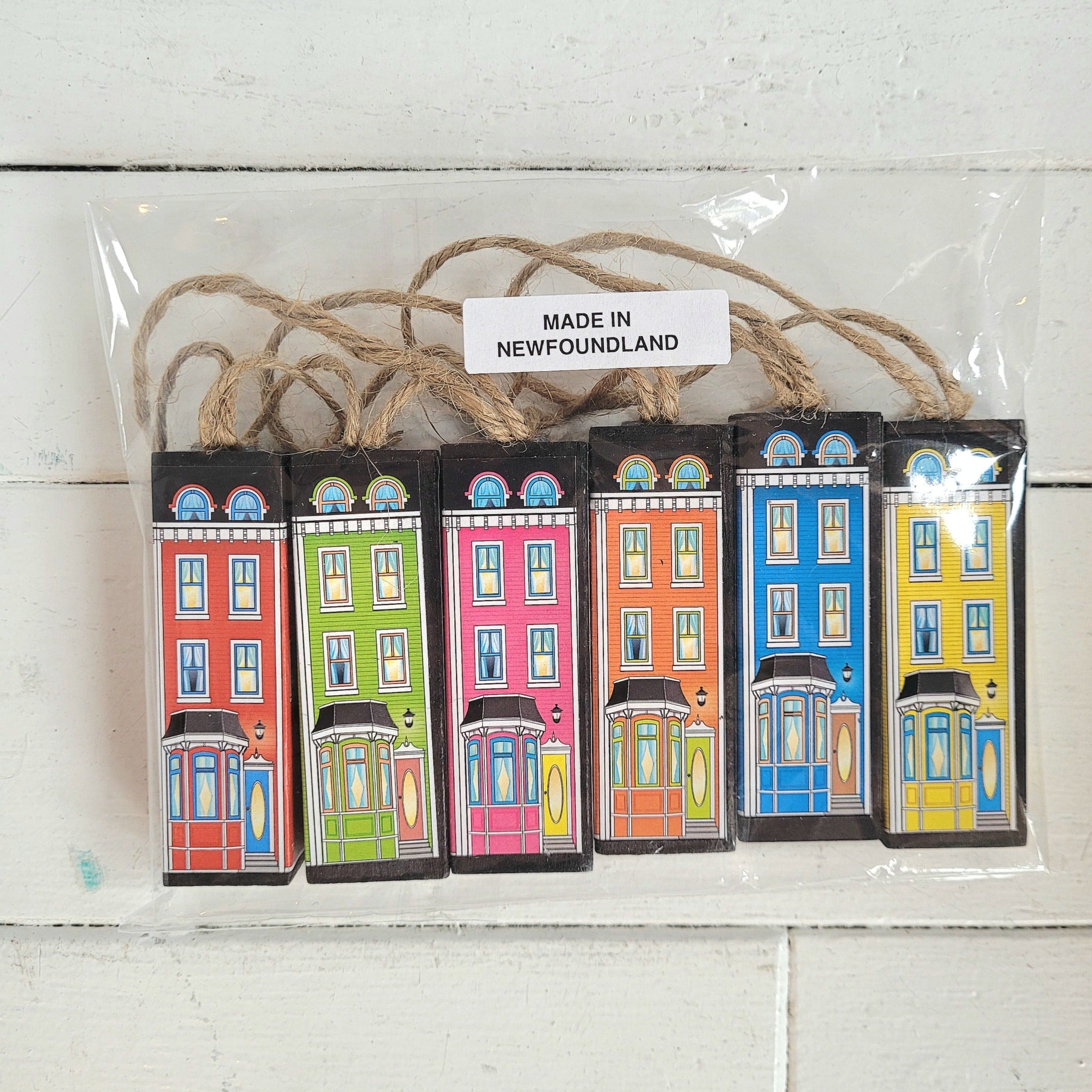 six tree ornaments featuring house designs and colors of Gower Street in St. John's and made in Newfoundland