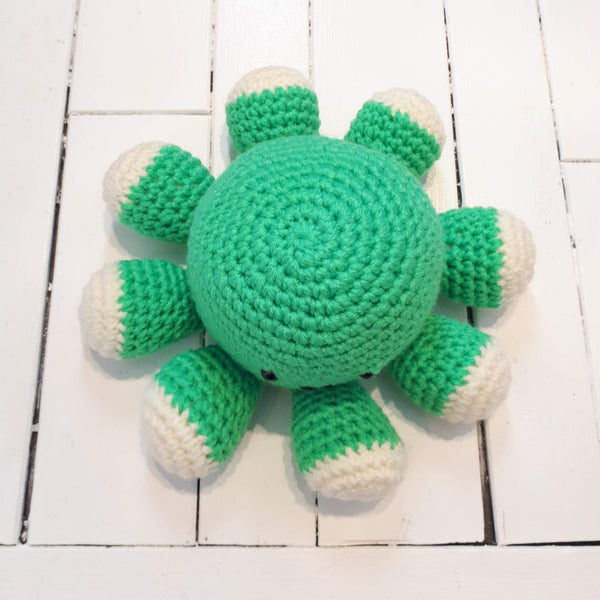 Green crocheted plush octopus made in Newfoundland.