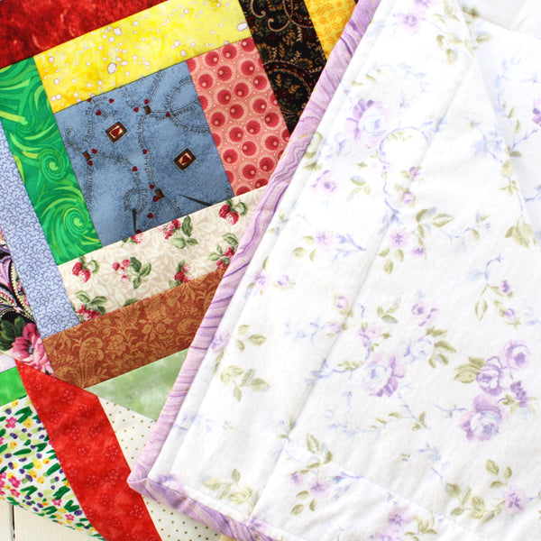 patchwork quilt with floral flannel backing