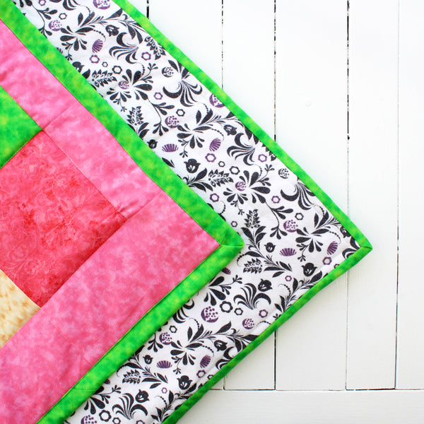 colorful cotton top snuggle quilt with flannel backing