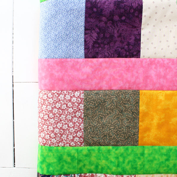 snuggle quilt with colorful patches and patterns