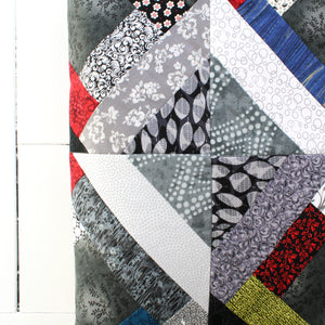 squares and stripes patchwork quilt with darker colors and patterns