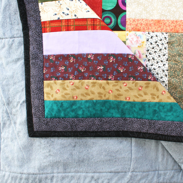striped patchwork quilt with plain flannel backing